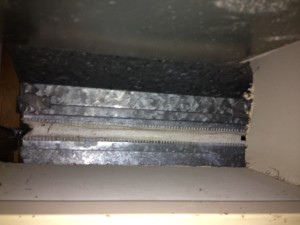 flexible duct connector - contains asbestos, and easy to miss